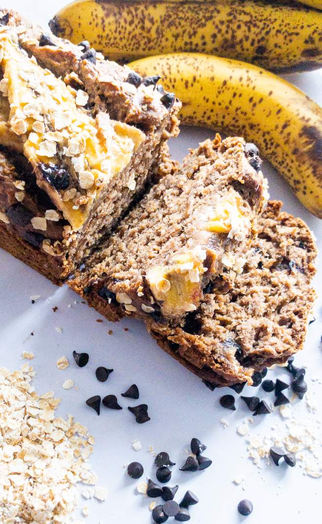 Oats Chocolate Banana Bread with chocolate chips oats and banana beside it