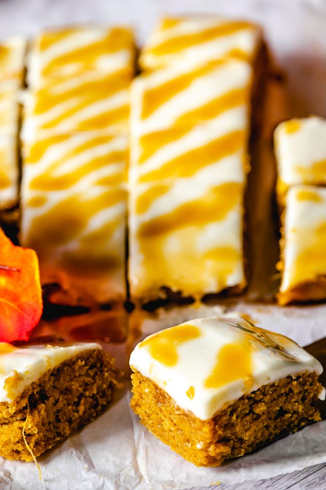 pumpkin bar with cream cheese frosting with one in closeup