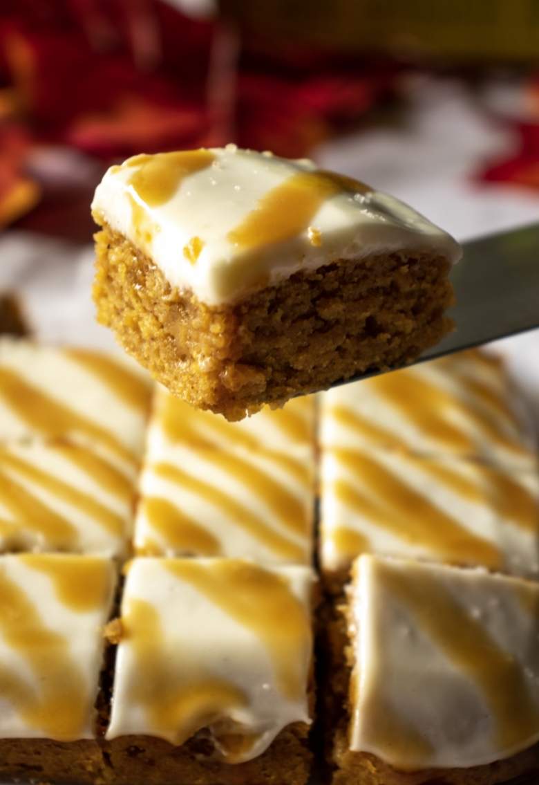 pumpkin bar with cream cheese frosting in an offset spatula