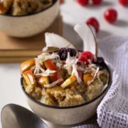 aA bowl full of Quinoa with apple and coconut