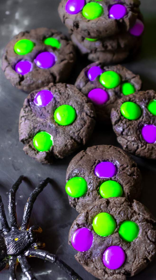 A bunch of Spooky Halloween M&M Cookies with Green and Purple M&Ms
