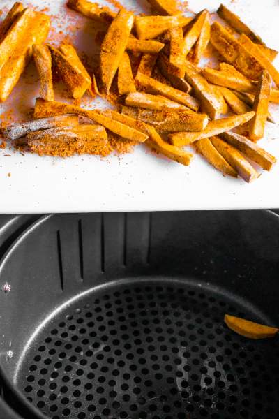 Throwing Sweet Potatoes in the Air Fryer for frying