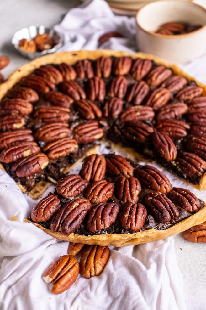 Chocolate Bourbon Pecan Pie with a piece cut out