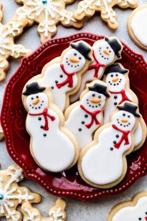 snowman cookies in a red serving platter