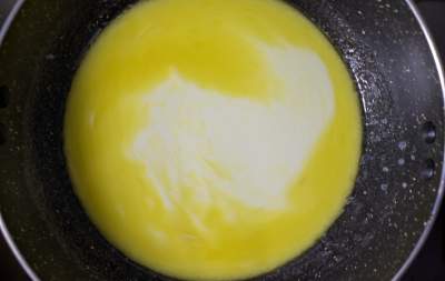 Butter and half and half in a black pan