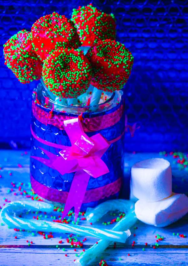Christmas Candy Cane Marshmallow Pops in a gift jar with candy canes and marshmallows on the side