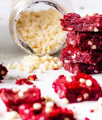 Red Velvet Brownies with White Chocolate Chips arranged in a stack