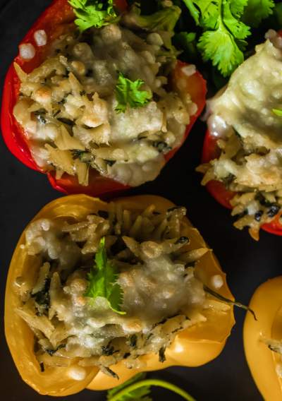 Spinach Ricotta Orzo Stuffed Peppers with cilantro on top