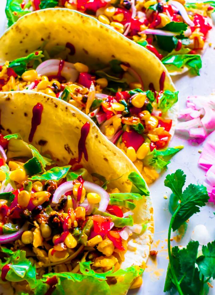 Healthy Vegetarian Black Bean and Corn Tacos with fresno pepper crema