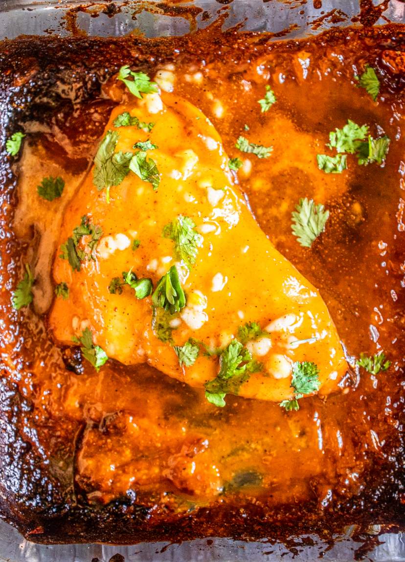 Honey Mustard Chicken Breasts in a baking dish with cilantro