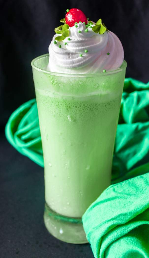 Shamrock shake with cherry and green cloth