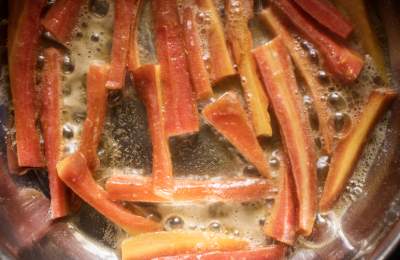 roasting carrots in butter in a pan