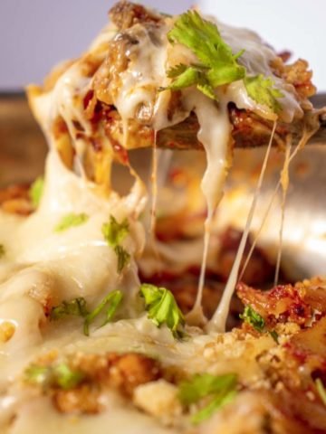 Cheese pull with pasta in a skillet