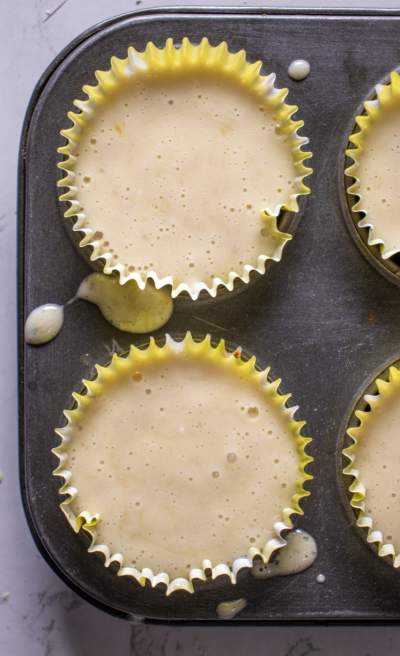 Mini Banana Cheesecakes batter in muffin tin 