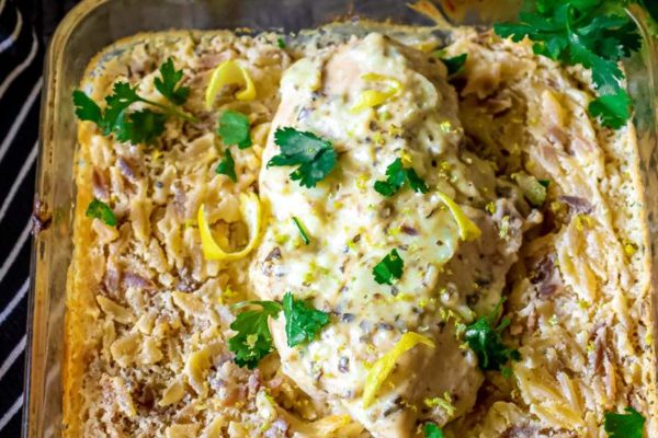 orzo in a baking dish with chicken on it