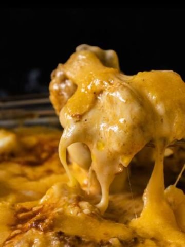 cheese pull shown by spoon