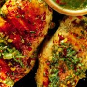 Grilled Chimichurri Chicken on a black plate
