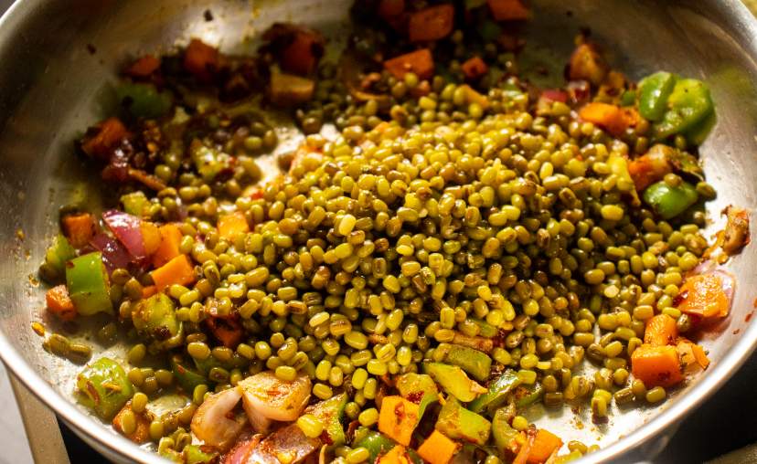 lentils added to the pan with sauteed veggies