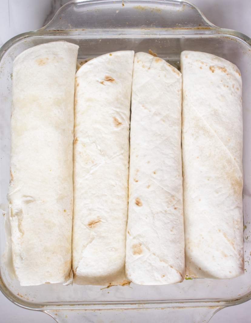 rolled tortillas in a baking dish