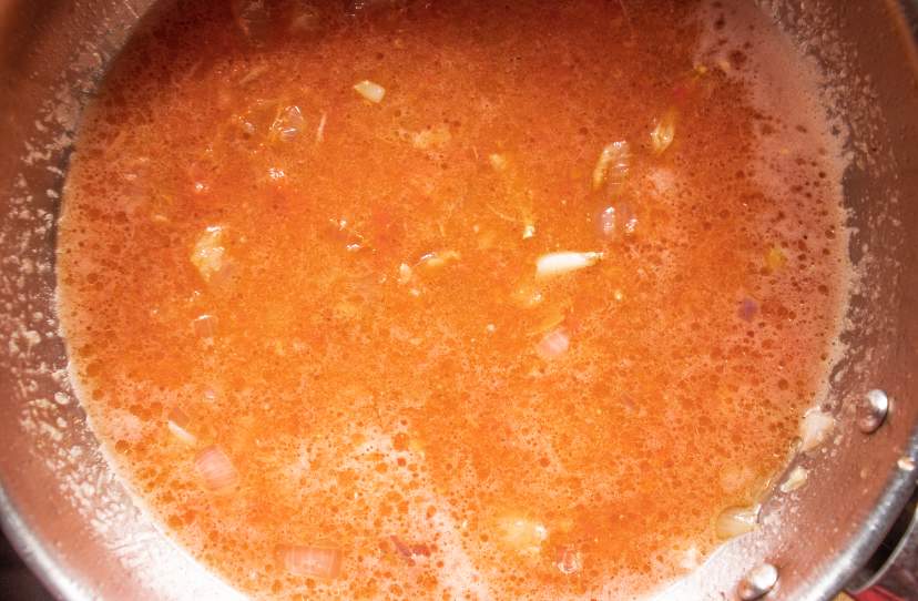 simmering marinara sauce in a skillet