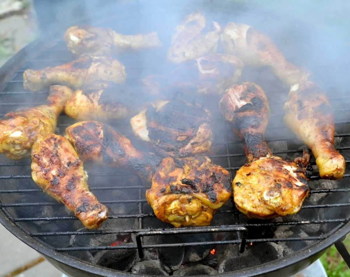 grilling chicken in an outdoor grill