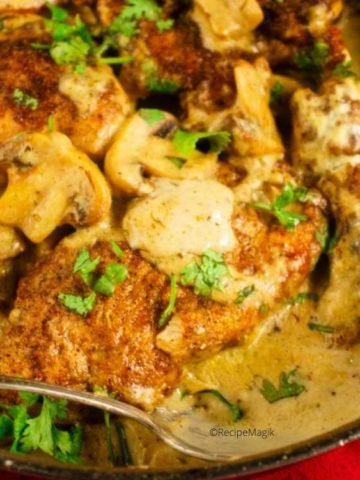 chicken marsala with a spoon in a skillet