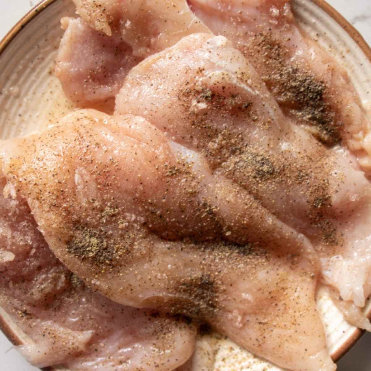 chicken breasts seasoned with salt and pepper