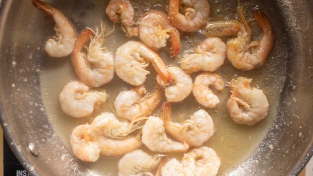 cooking shrimps in a skillet