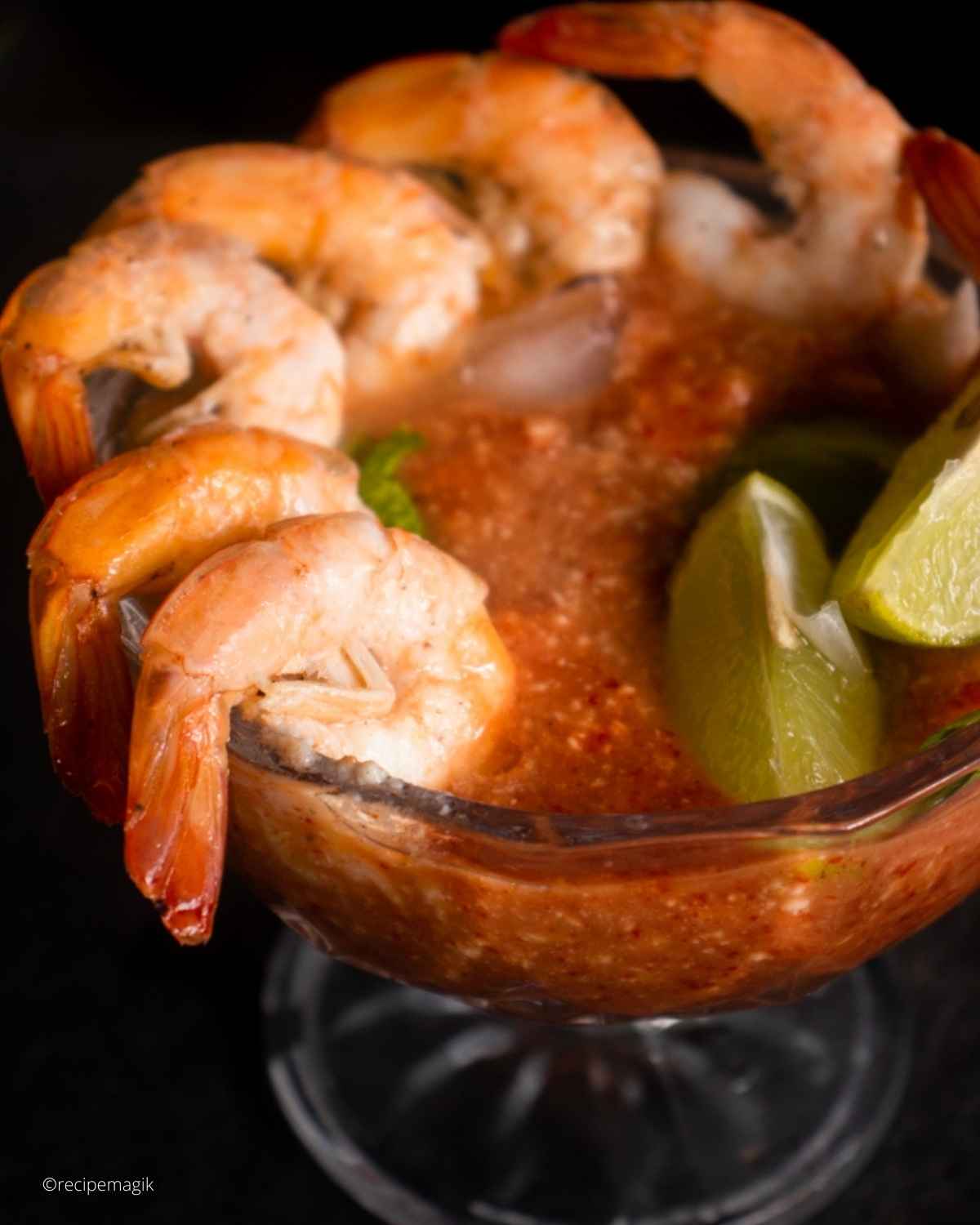 shrimp cocktail in a glass with cocktail sauce