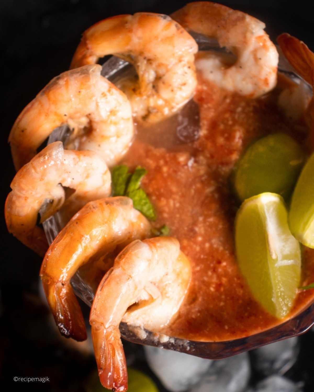 shrimp cocktail in a glass with cocktail sauce