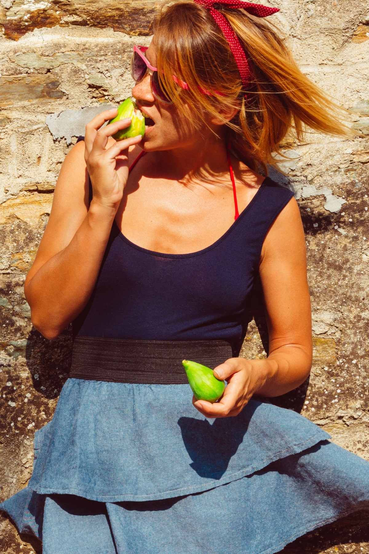 a girl eating fresh figs