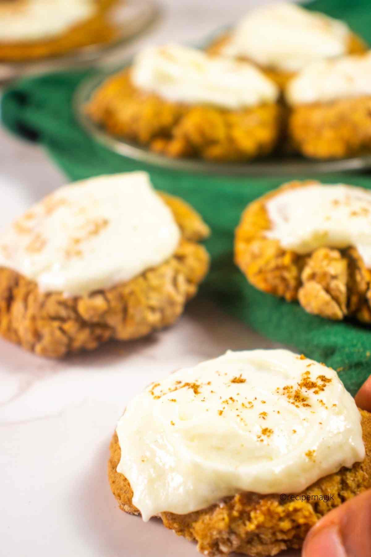 Zucchini Cookies with Cream Cheese Frosting and cinnamon on top