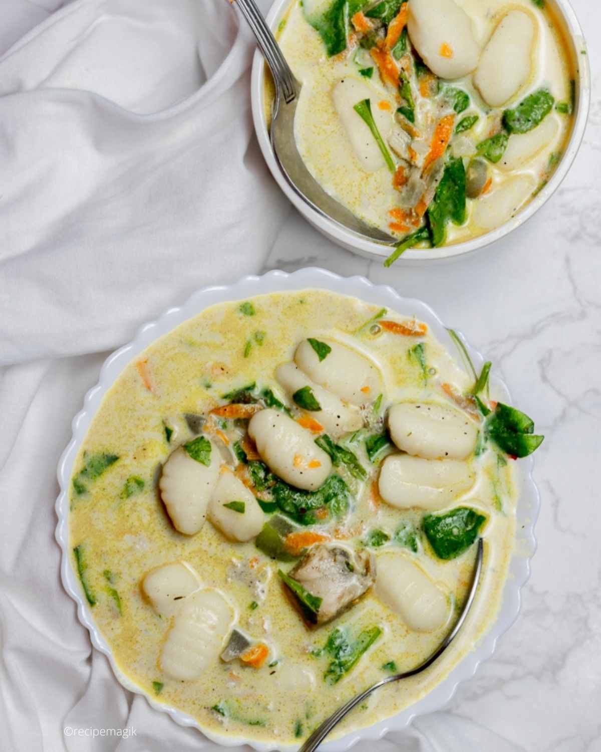 chicken gnocchi soup in two bowls
