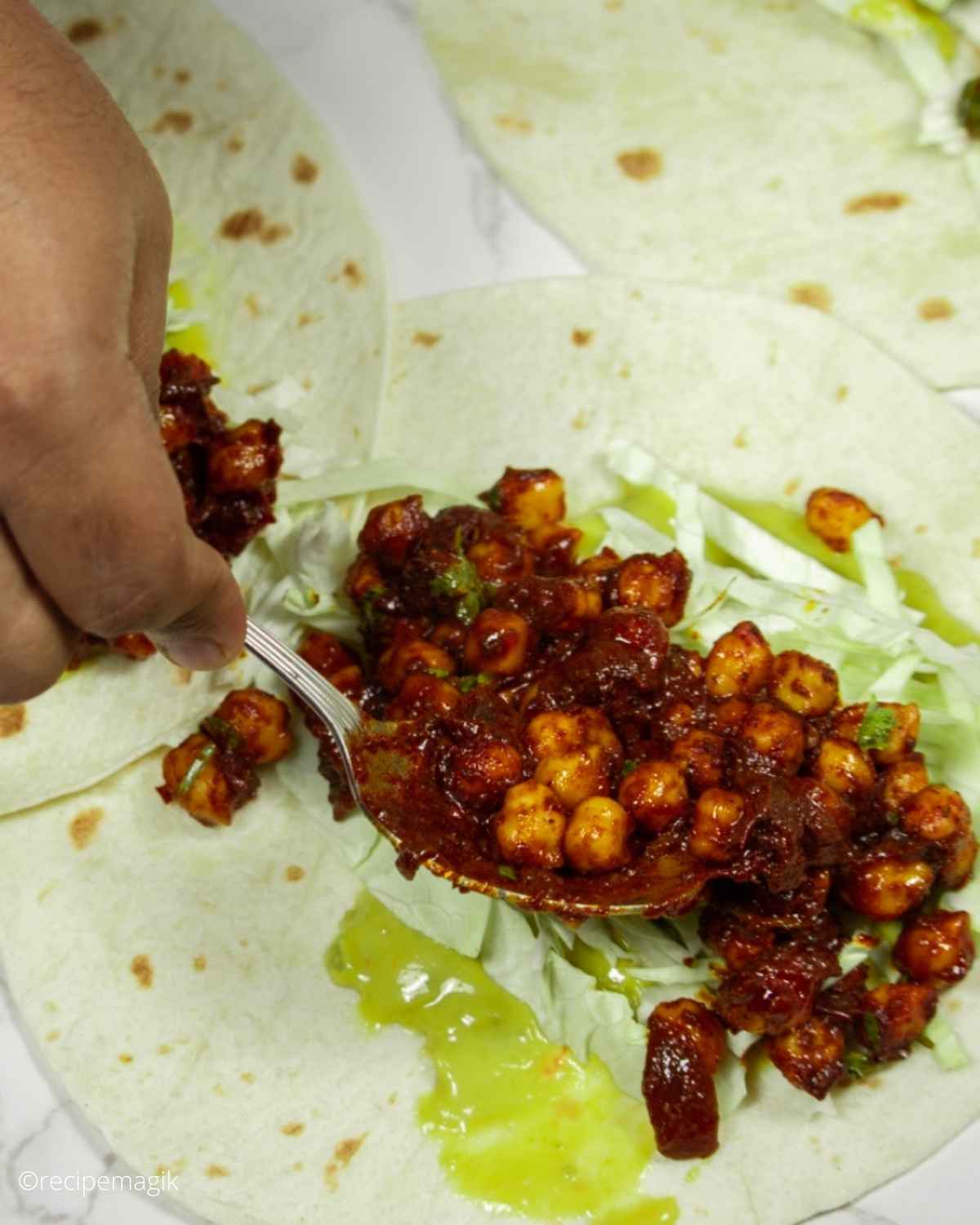 assembling chickpeas in tacos