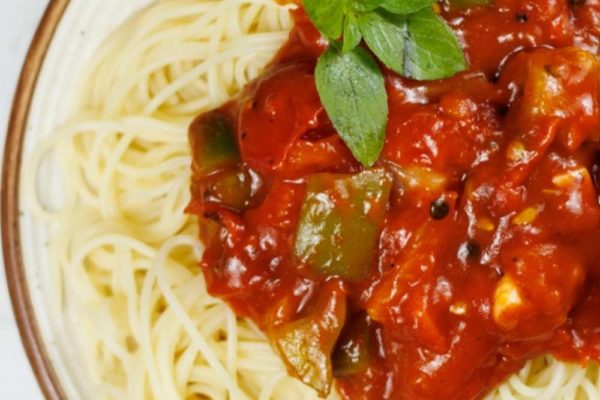 overhead shot of meatless spaghetti sauce with basil
