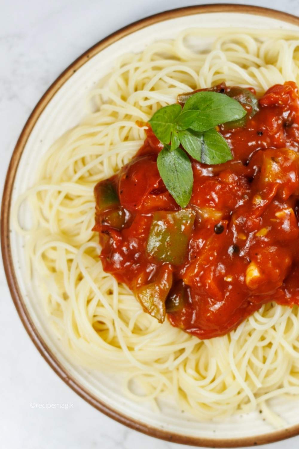 overhead shot of meatless spaghetti sauce with basil