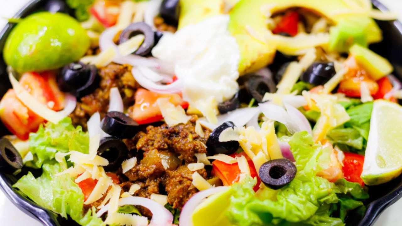 easy taco salad in a black bowl