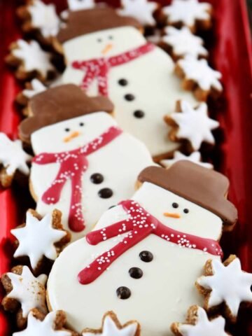 snowman cookies kept in a red tray