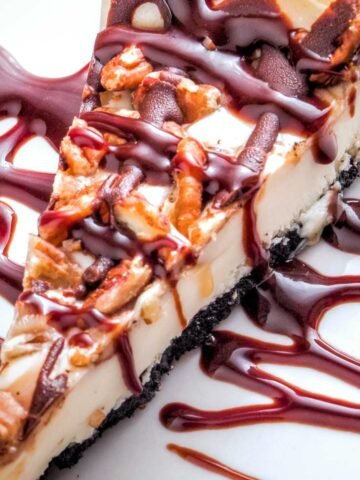 turtle cheesecake with caramel and chocolate sauce