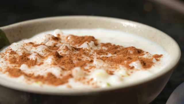 simmering milk and heavy cream with spices