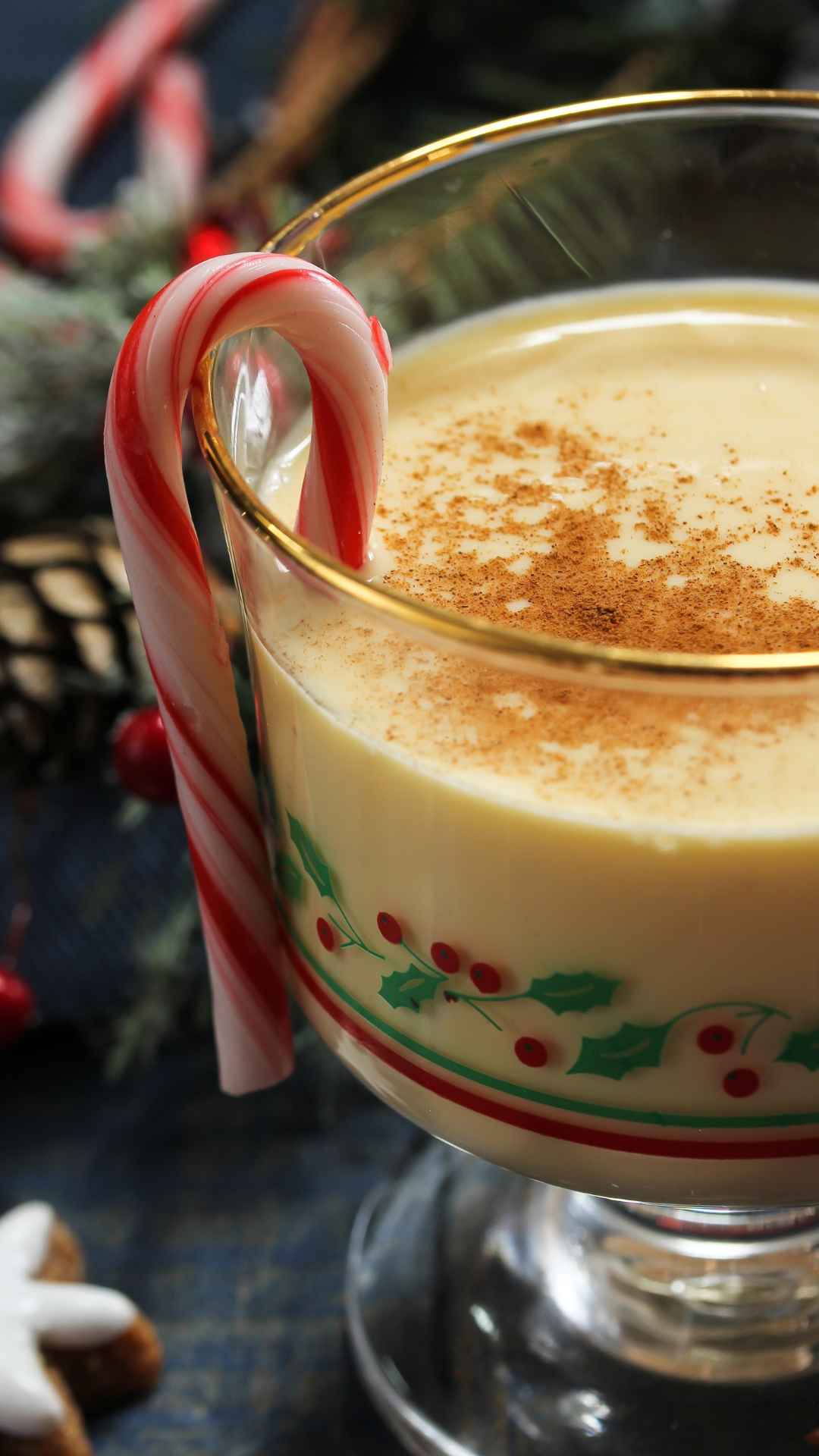 homemade eggnog in a glass jar with ground nutmeg on top