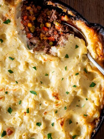turkey shepherds pie with topped with dill and parsley