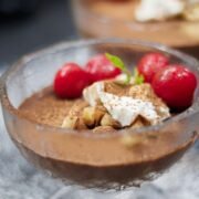 vegan chocolate pudding with cherries and hazelnuts
