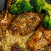 marry me chicken on a black plate with broccoli