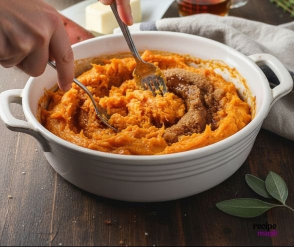 mashing sweet potatoes for Bourbon Pecan Sweet Potato Casserole