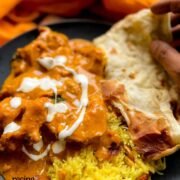 Authentic Indian Chicken Curry made in Crockpot served with naan bread and pilau rice