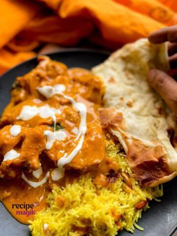 Authentic Indian Chicken Curry made in Crockpot served with naan bread and pilau rice