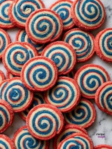 patriotic pinwheel cookies laid out on table