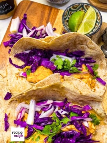 Baja Chicken Tacos served inside warm tortillas topped with mexican slow and cilantro lime
