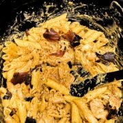 Slow Cooker Cajun Ranch Chicken Pasta with crispy bacon on top